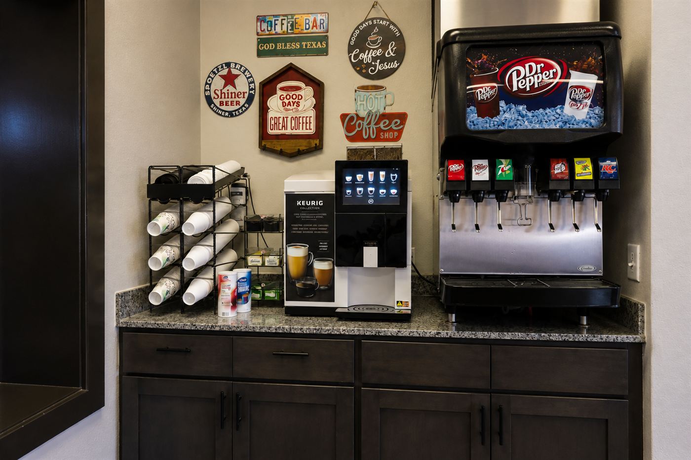 Complimentary coffee bar with a Keurig and soda fountain