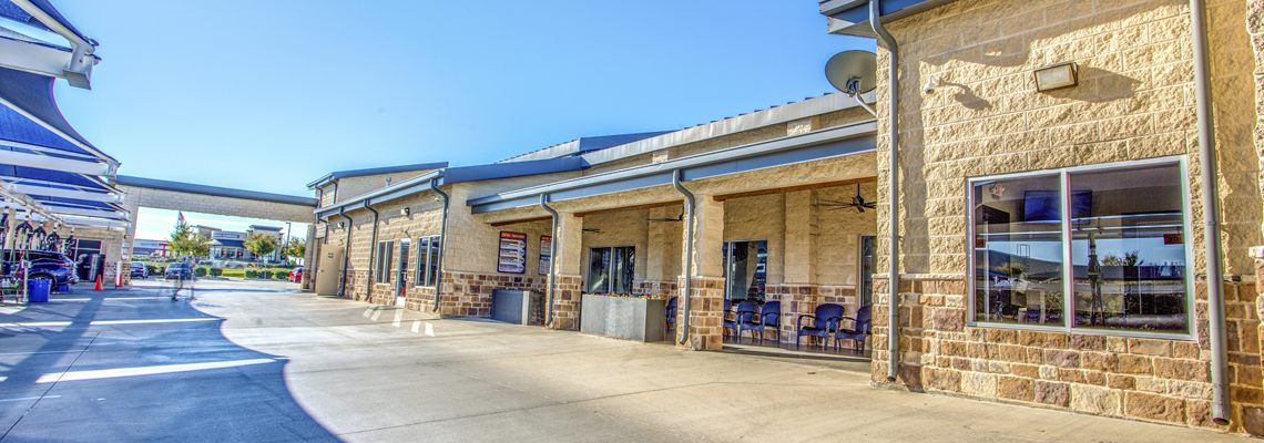 Covered walkway and waiting area outside the Detail Center