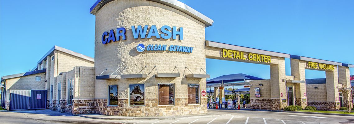 Clean Getaway storefront with the Car Wash tower and Detail Center archway on a sunny day